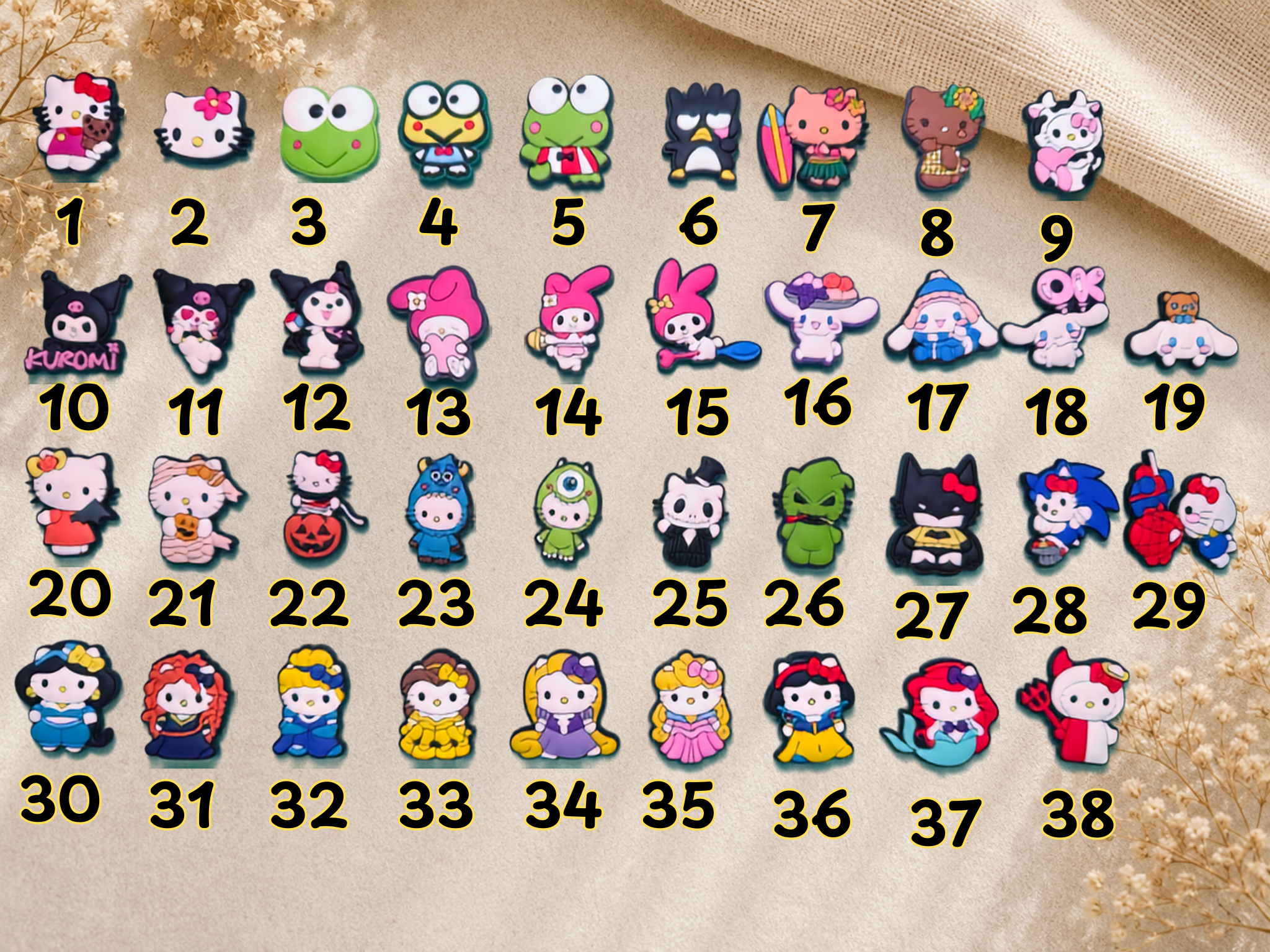 Collection of thirty eight numbered Kitty shoe charms featuring various cartoon characters