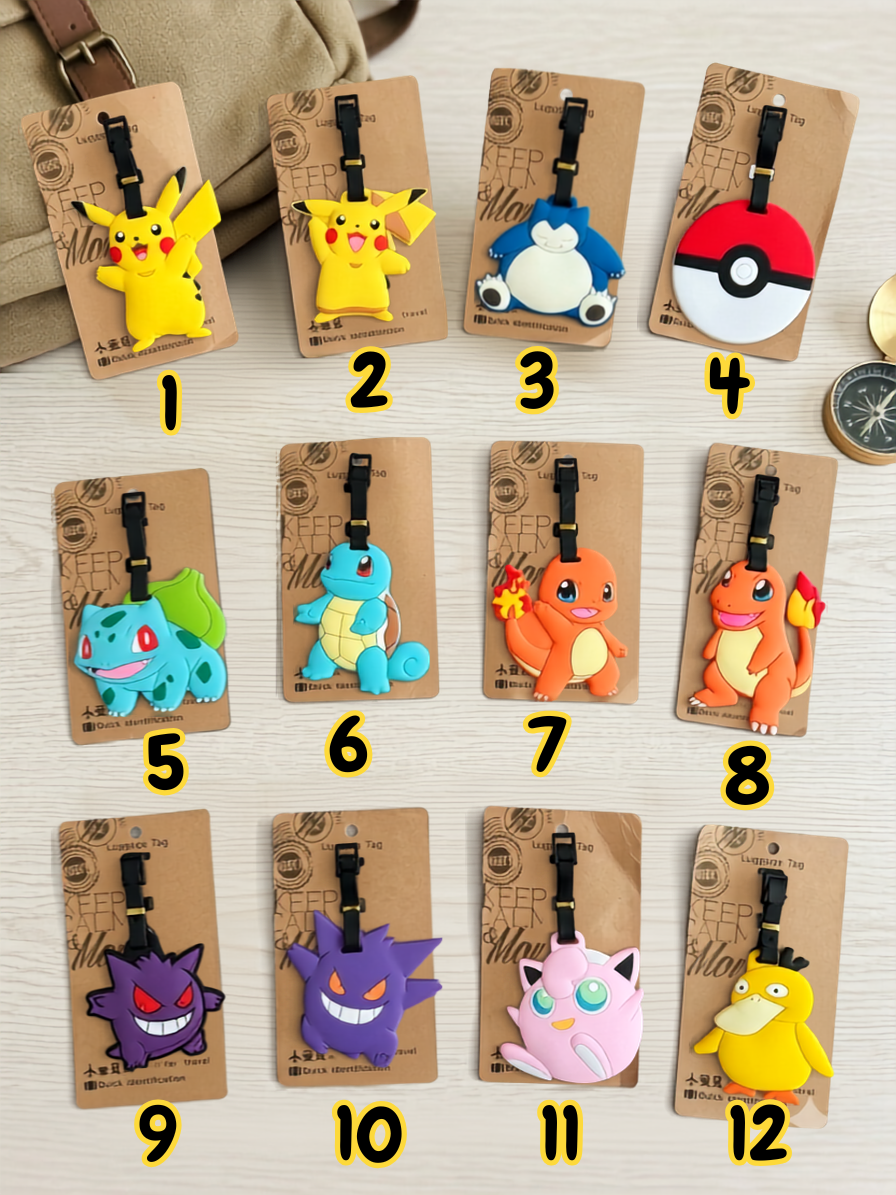 Twelve monster-themed luggage tags arranged in a grid on a light wood surface, each on a brown cardboard backing with a black strap and numbered 1 through 12 in yellow text.