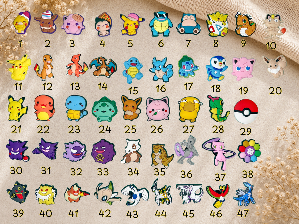 A grid of 47 small cartoon character pins or charms, each numbered 1 through 47, arranged on a beige textured fabric background with dried floral decor.