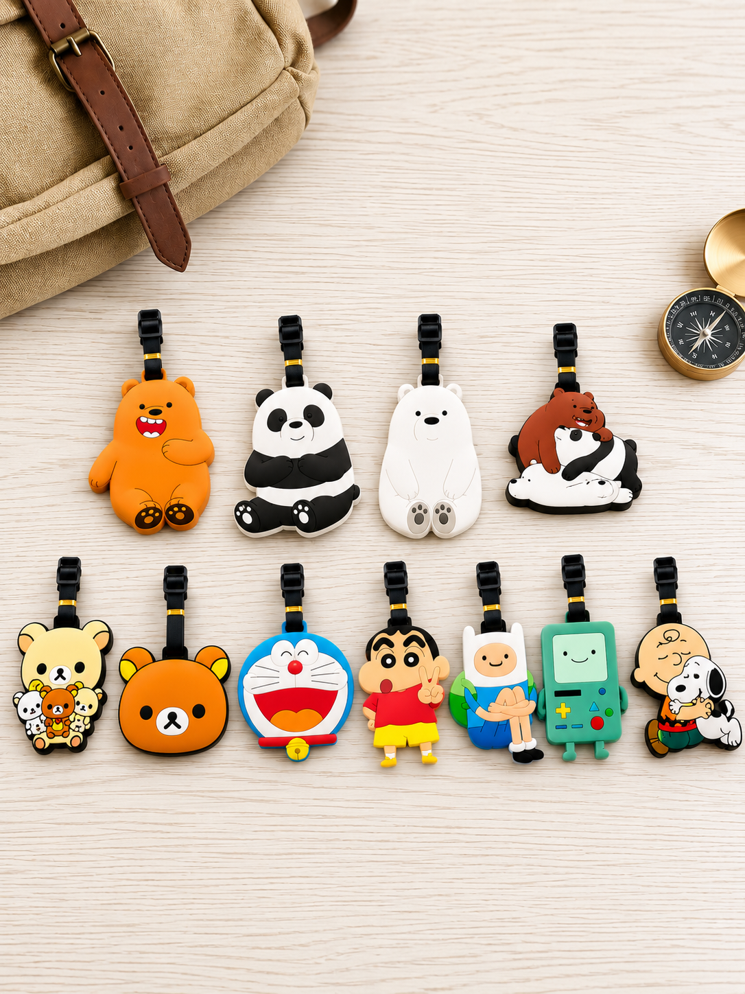 Assorted cartoon character Bear Luggage Tags arranged on a wooden surface