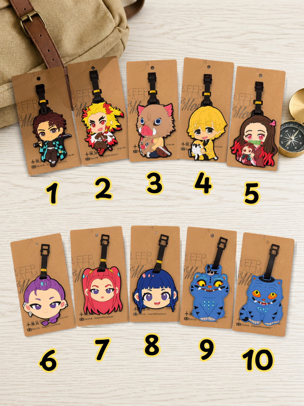 Ten assorted anime character luggage tags displayed on cardboard backing