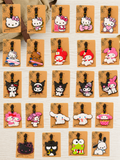 Collection of cute character Kitty luggage tags on display cards