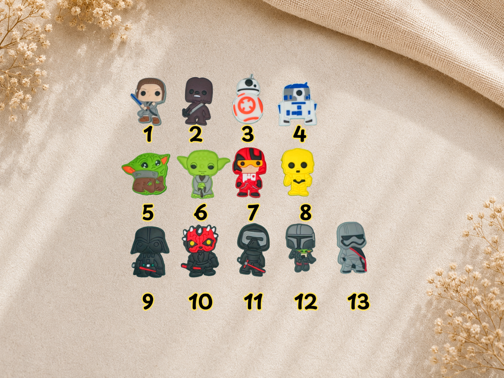 Numbered selection of thirteen Space War shoe charms featuring various character designs