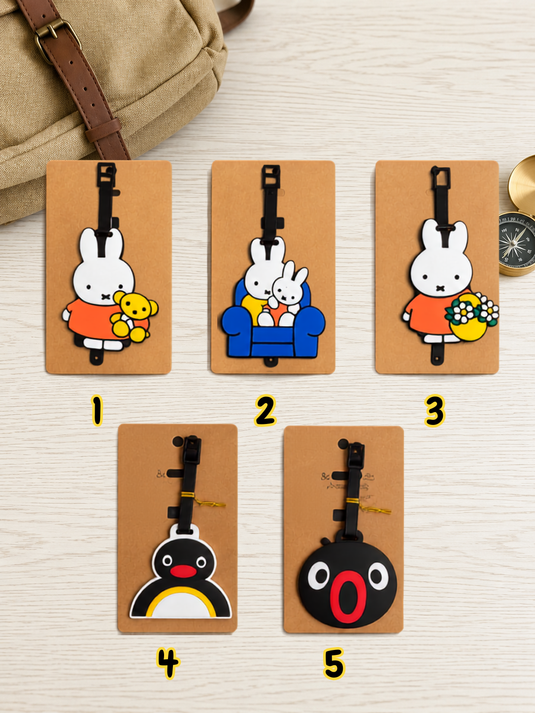 Five Rabbit Penguin luggage tags featuring Miffy and Pingu characters on display cards