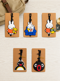 Five Rabbit Penguin luggage tags on cardboard backing
